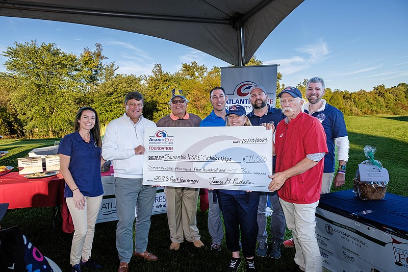 From left, Kristin Jackson, Jim Rutala, Roman Osadchuck, Ryan Smith, Jean McAlister, Zack Mullock, Robert Mullock and Chris Mularz