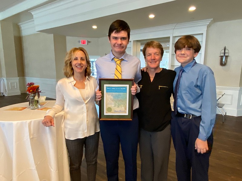 From left, Lucy Paccione, Andrew Scheffey, his mother Brenda and brother Patrick.