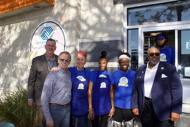 Provided/From left, Hard Rock General Manager Mike Sampson, President George Goldhoff, Boys and Girls Club Director of Hospitality Pam Green, baristas Trenasia and Jeremiah, B&GC CEO Dr. Charles A. Wallace IIIM and barista Ty (pictured in the window).