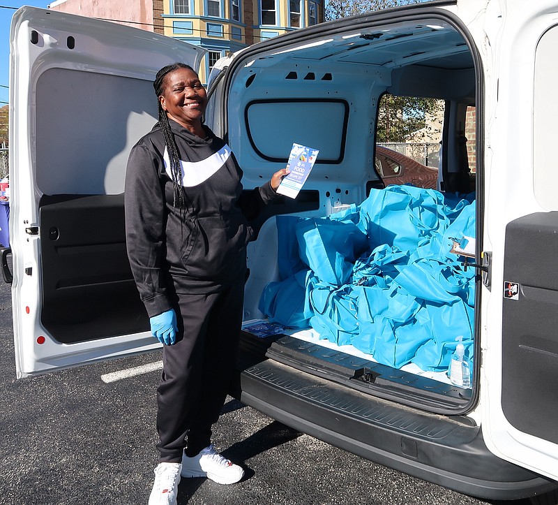 Provided/Jewish Family Service staff member Elaine Gilles packs food bags to be delivered to the agency's Atlantic City office location.