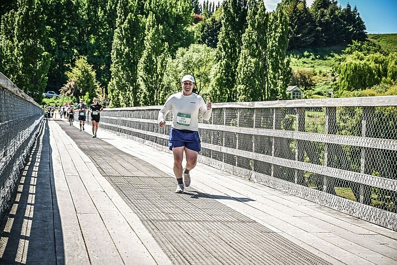 Dan McCann crosses over a bridge while running in the New Zealand marathon. (Photos courtesy of Dan McCann)