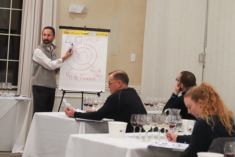 Michael Bray, owner of Passion Vines, speaks to students in his Wine Foundations class about the different regions of wines. (Photos courtesy of Passion Vines)