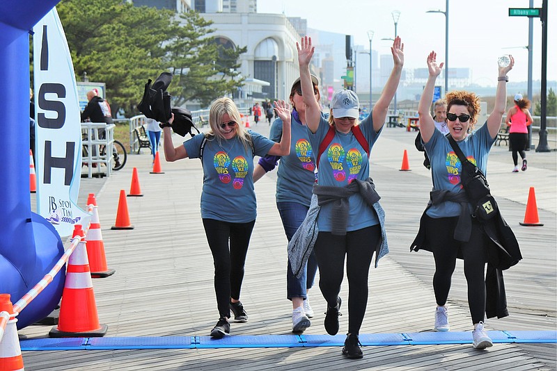 Provided/Runners cross the finish line at the 13th annual Seashore Gardens Foundation 5K Run to benefit Alzheimer's and dementia outreach.