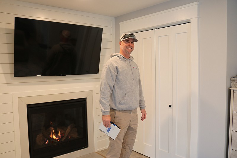 Dean Dooley gives a tour of the interior of an Ocean City home on Central Avenue he painted.