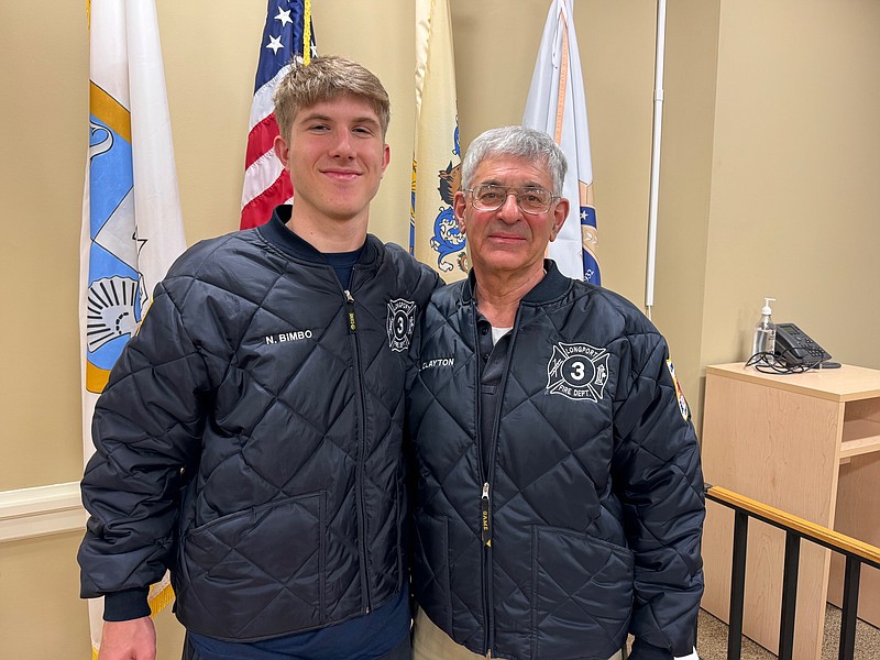 From left, future Junior Firefighter Nicholas Bimbo, 17, and his grandfather Longport Volunteer Fire Chief Levon "Lefty" Clayton.