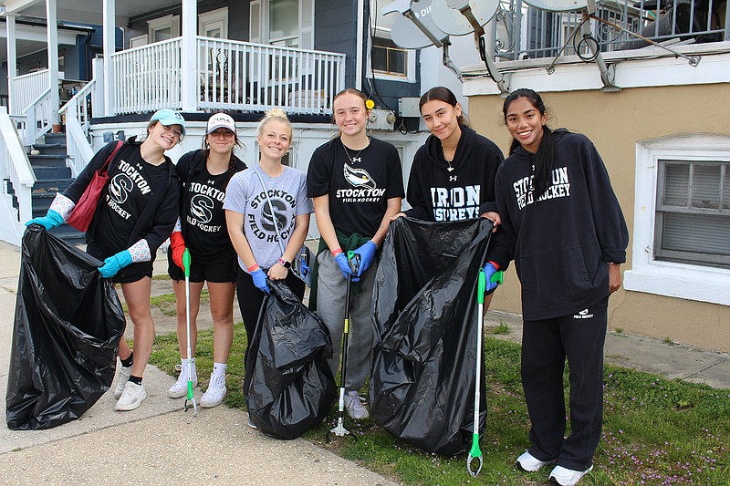 Provided/Members of the Stockton University field hockey team collect trash in the Lower Chelsea section of Atlantic City at last year's event.