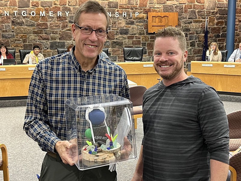 Montgomery Township Environmental Advisory Committee (EAC) member Don Hamp, left, was presented with a sculpture made of single-use plastic products b