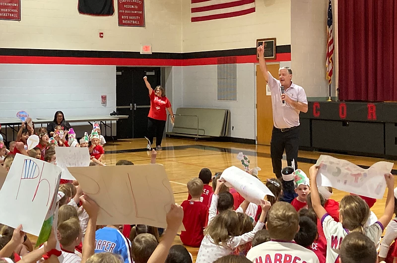 Former Philadelphia Phillies pitcher Jamie Moyer leads students at Corpus Christi Catholic School in a Phillies chant at a school pep rally. 