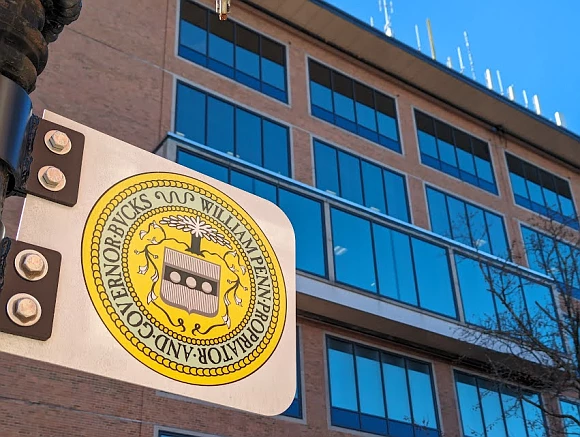 A sign with the Bucks County seal outside the county government Administration Building. 