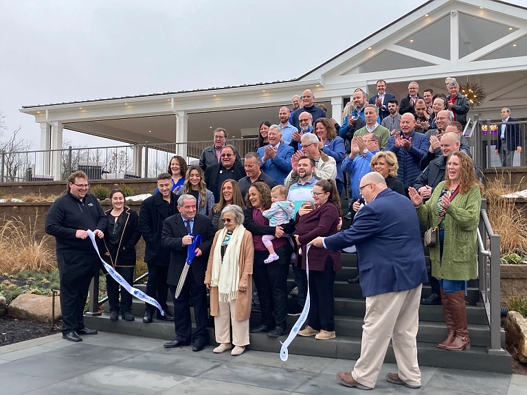 Sal Lapio cuts the ribbon at the grand opening celebration of the Pavilion at Mainland, a new wedding and event venue in Harleysville. 