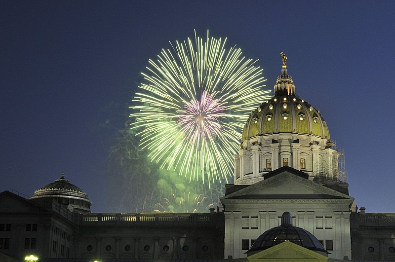 Fireworks explode over the Pennsylvania state Capitol building. 