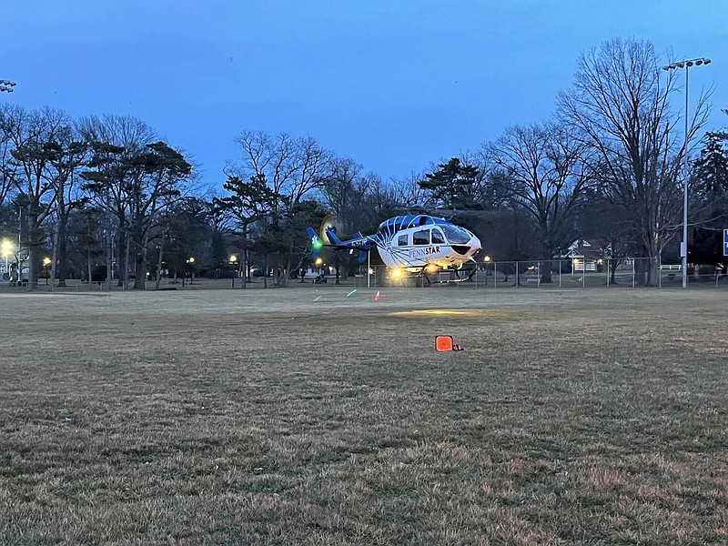 A PennStar medevac helicopter awaits transport of the child at Memorial Park. 