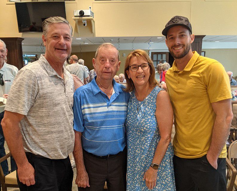 Jaime Moyer, left, with his father, Jim Moyer, second from left. 