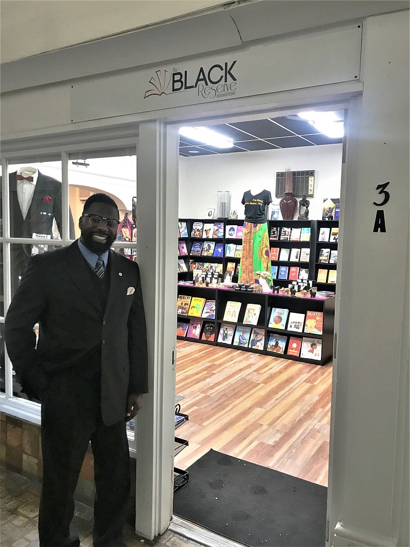 Shaykh Anwar Muhammad stands outside of his shop, The Black Reserve Bookstore, while it was still located inside of Lansdale's Dresher Arcade in Octob