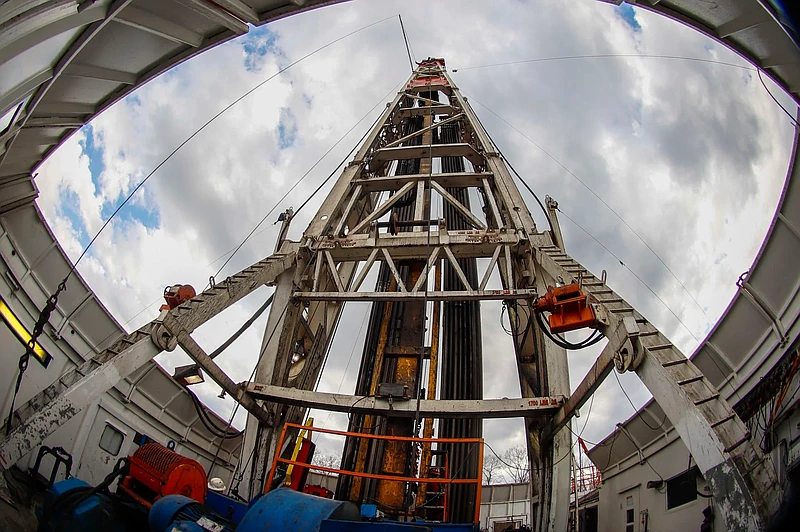 Workers change the equipment March 12, 2020, on the drilling platform at a Seneca Resources shale gas well drilling site in St. Mary's, Pennsylvania. 