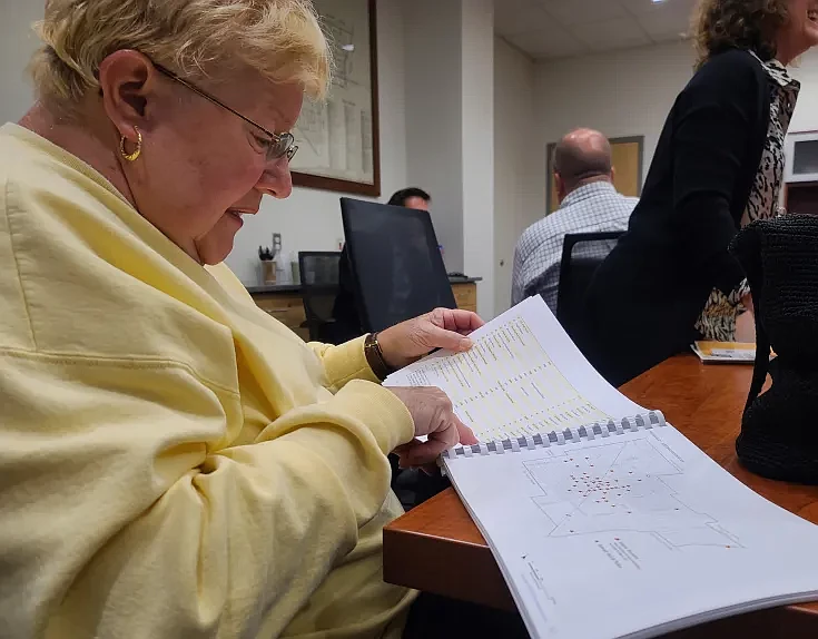 Lansdale resident Jean Fritz reads a list and map of historic properties in Lansdale as listed in the borough’s 2020 comprehensive plan, during the co