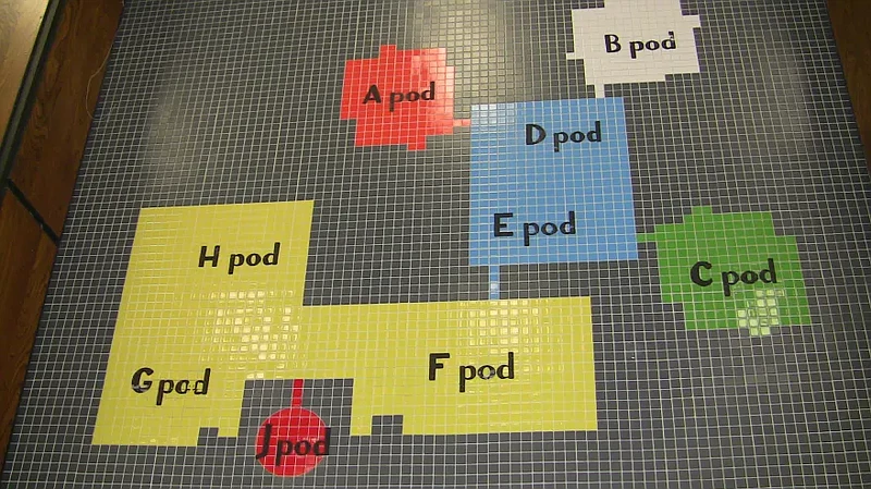 A map of painted tiles inside the main lobby shows the various classroom “pods” throughout North Penn High School. 