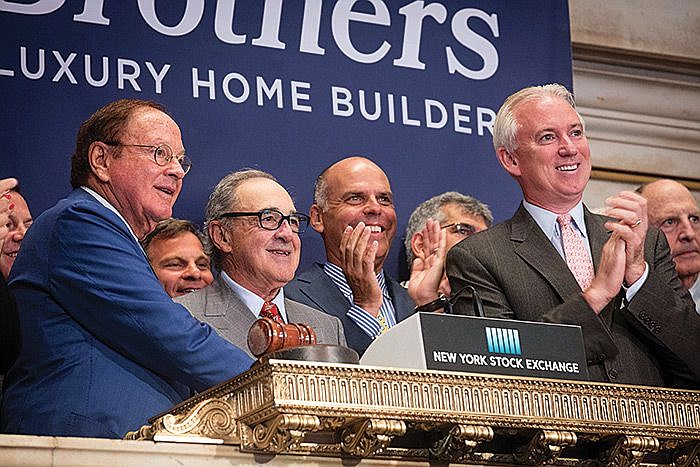 Robert Toll, center, at the New York Stock Exchange in 2016. 