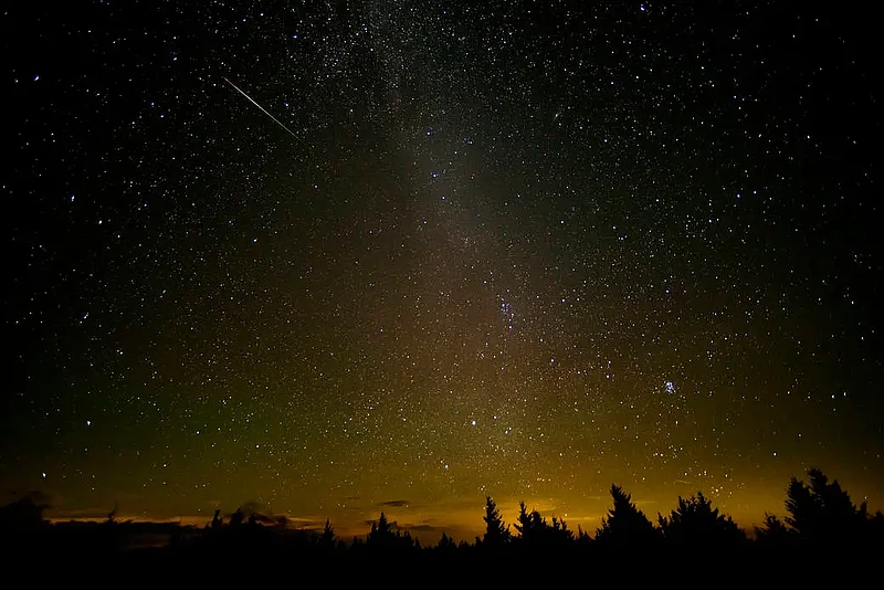 In this 30 second exposure, a meteor streaks across the sky during the annual Perseid meteor shower Friday, Aug. 12, 2016 in Spruce Knob, West Virgini