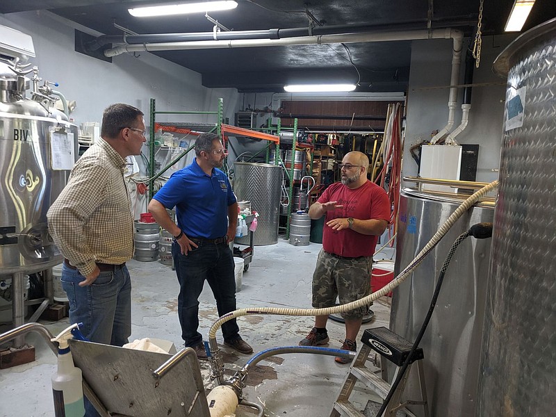 From left to right: Adam Harris, Deputy Director of the Brewers of Pennsylvania, Rep. Steve Malagari, and Scott Rudich, Owner/Head Brewer of Round Guy