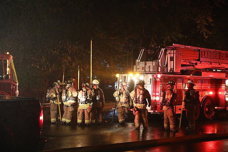 Firefighters from multiple volunteer fire companies respond to a dwelling fire in Montgomery Township on Oct. 3. 