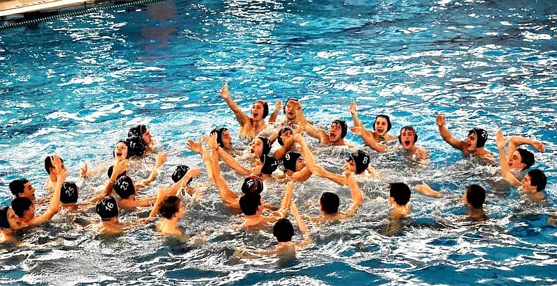 The 2019 North Penn Boys Water Polo team celebrates their state title. 