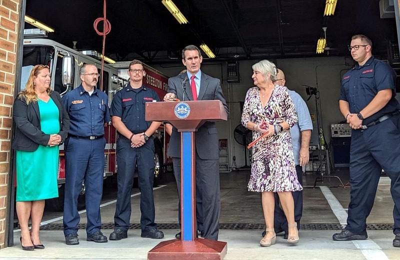 Pennsylvania Auditor General Eugene DePasquale (center) addresses a news conference Oct. 8, 2019, in Steelton, Pennsylvania. 