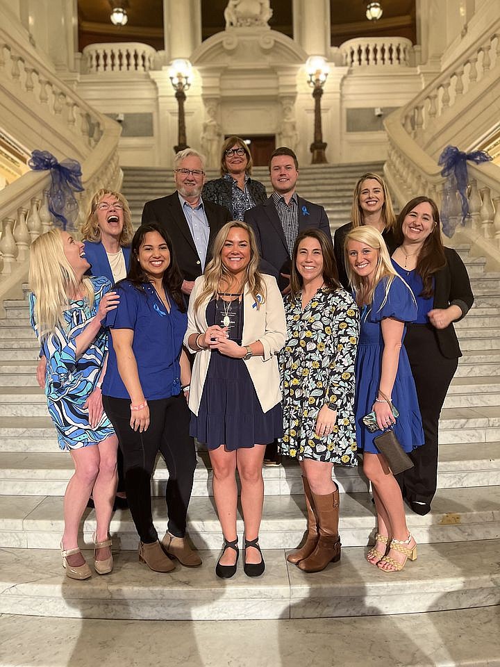 Mission Kids’ Director of Prevention Education and Outreach, Michelle McDyre, center front, was recently honored by the Pennsylvania Family Support Al