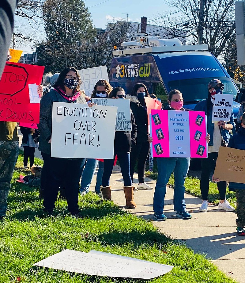 Parents hold a peaceful protest outside of the Montgomery County Office of Public Health on Saturday, Nov. 14. 