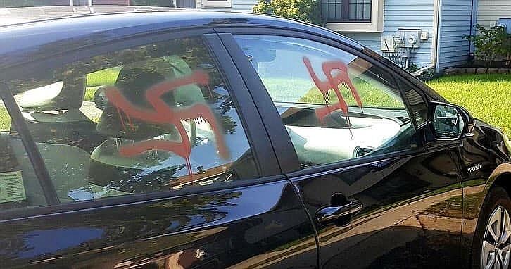 Swastikas painted on the windows of the victim's vehicle. 