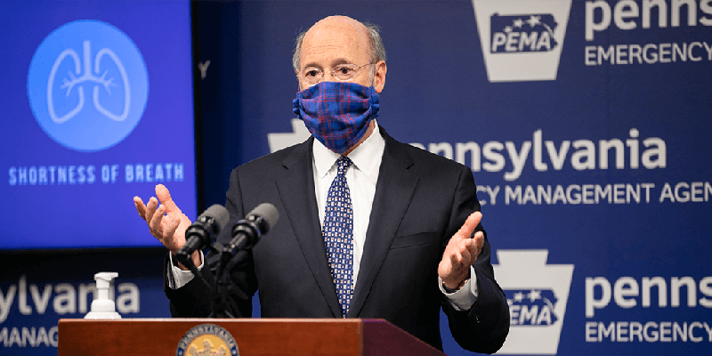 Gov. Tom Wolf wears a mask during a briefing at the Pennsylvania Emergency Management headquarters in Harrisburg. 