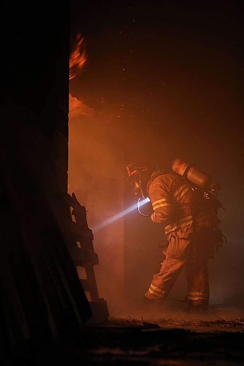 Members of the Upper Gwynedd Fire Department participate in a live-burn exercise on Oct. 19 at the George Haggar Fire Training Center in Upper Dublin 