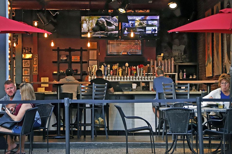 People gather at the North Shore Tavern in Pittsburgh on Sunday, June 28, 2020. 