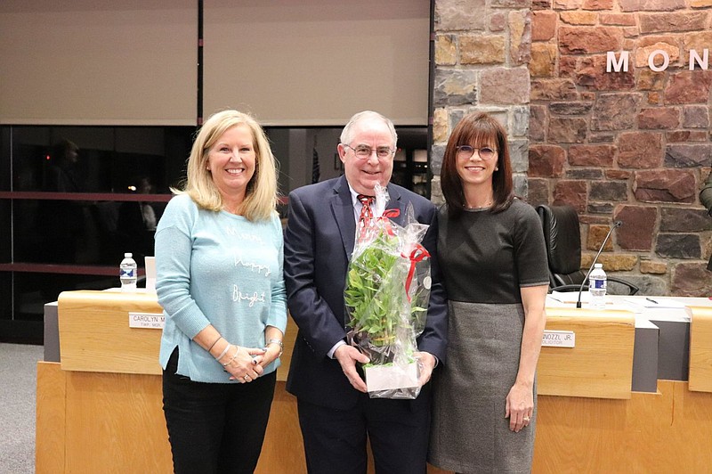 Supervisors Candyce Fluehr Chimera, left, and Tanya Bamford, right, with retiring township manager Larry Gregan, center. 