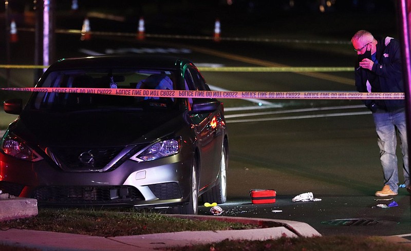 Lansdale Police Chief Michael Trail investigates the scene of the shooting on Nov. 28. 