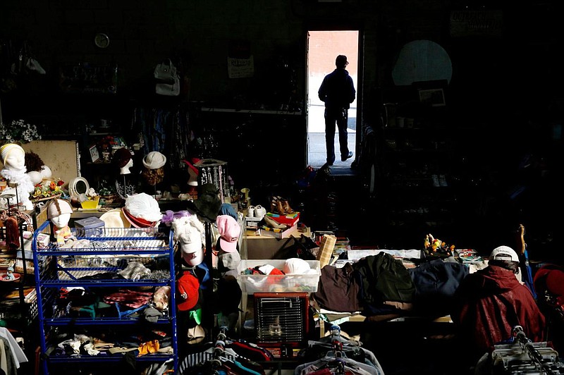 A customer walks from Outreach Ministries' thrift store March 7, 2016, in Philadelphia. 