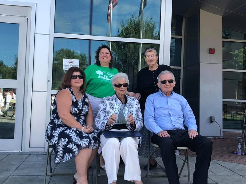 Georgette Koehler, center front, with her husband, Frank Koehler, front right, accepting the 2019 Lansdale Lifetime Achievement Award in 2019. 