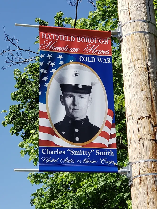 Charles Smith as an 18-year-old Marine is honored on a Hometown Heroes banner in Hatfield Township. 