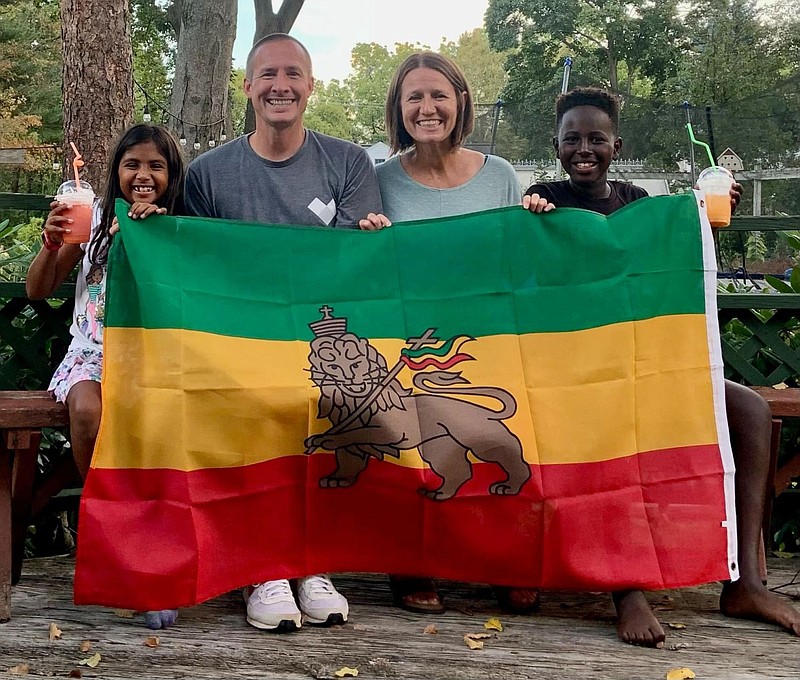 Biruk Sawtelle, right, with his adopted parents, Andrea Sawtelle, center right, Nate Sawtelle, center left, and his sister, left. 