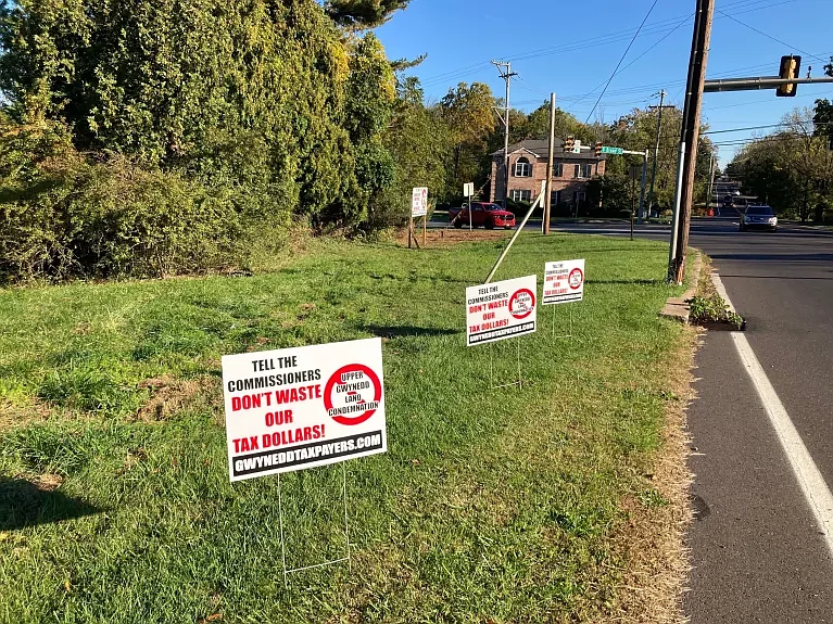 Signs posted along the “Martin Tract” on Allentown Road encourage passersby to voice their opposition to Upper Gwynedd’s commissioners about their pot