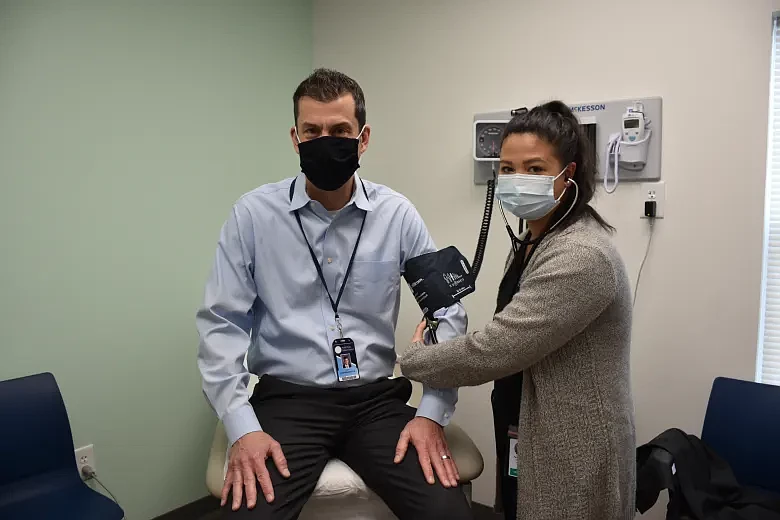 North Penn School District CFO Steve Skrocki has his blood pressure taken by Paola Reyes, a Clinical Supervisor with Everside Health, at the North Pen