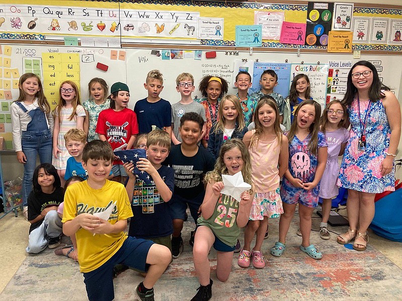 Mrs. Jacqueline Oberholtzer, right, and her second-grade class at North Wales Elementary School show their excitement and Flag Day skills learned duri