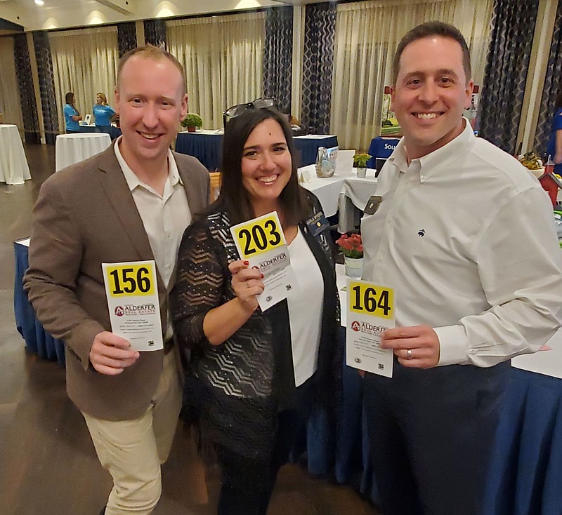 Rotarians Dan Yocum, Karla Myers, and Brad Bissinger attend the 2021 Souderton-Telford Rotary Annual Benefit Auction. 