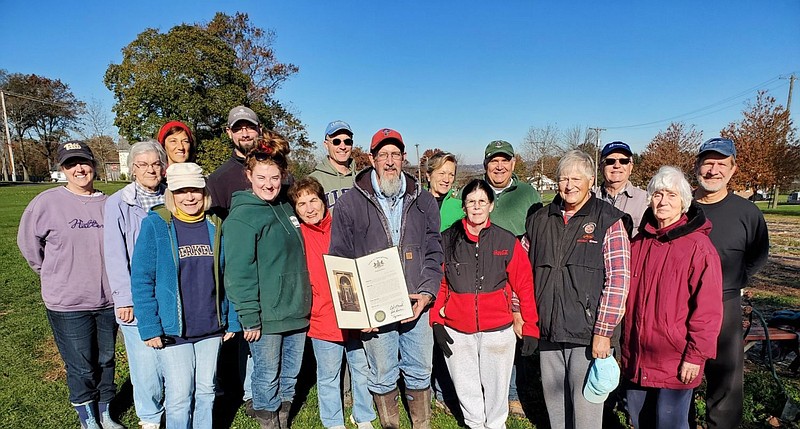 Volunteers who worked at the Salford-Advent Church Garden on Saturday, Nov. 6. Steve Blank, Garden manager (front, center), holds a Proclamation of th