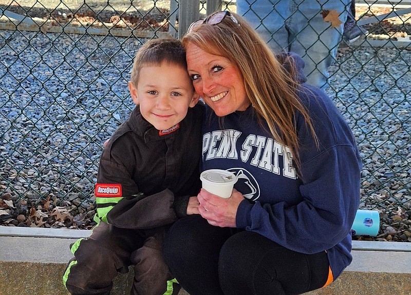 Trystin McGuire, left, with his mother, Janel Conrad, right. 