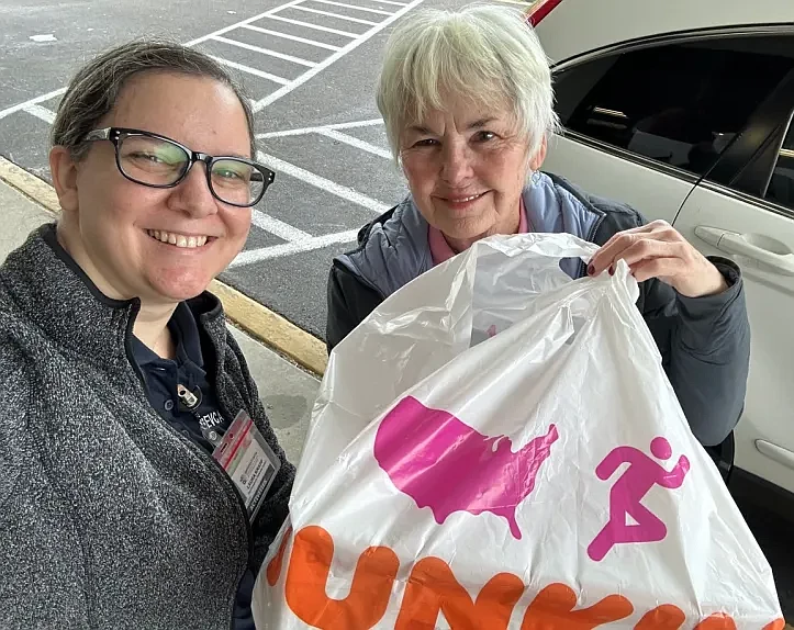 Laura Knapp, pictured at left, of SVEC Activities department received the treats from Towamencin Daughter Joan LaMonica. 