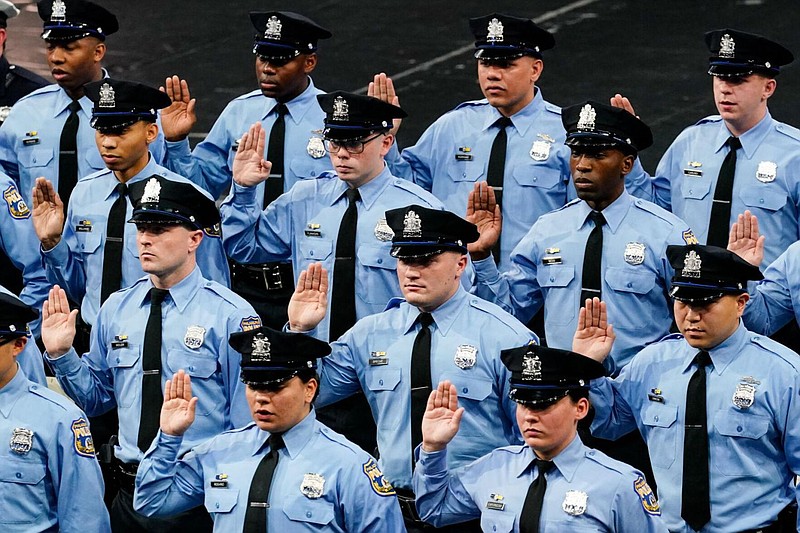 Members of the Philadelphia Police Academy Class #395 take the oath to become officers in Philadelphia, Friday, April 8, 2022. 