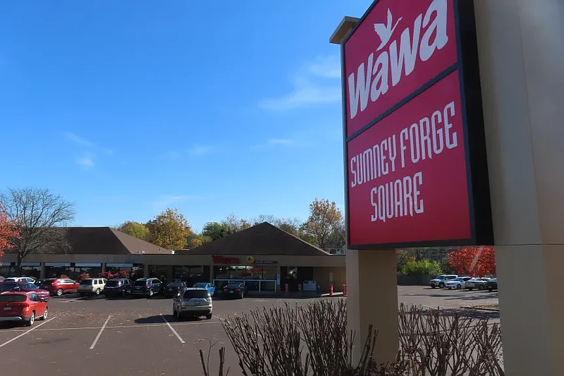 Cars sit parked in the parking lot of the Wawa convenience store in the “Sumney Forge Square” shopping center in Upper Gwynedd in November 2022. 