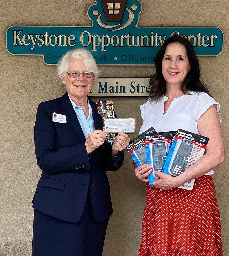 Susanne Johnston of the Towamencin Chapter DAR, left, presents check to Susan Clauser of Keystone Opportunity Center. 