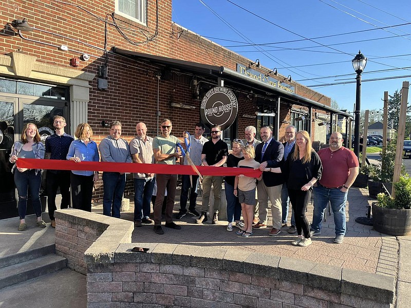 Officials from the Chamber of Commerce for Greater Montgomery County, along with Round House owners, managers, staff, and elected officials held a rib